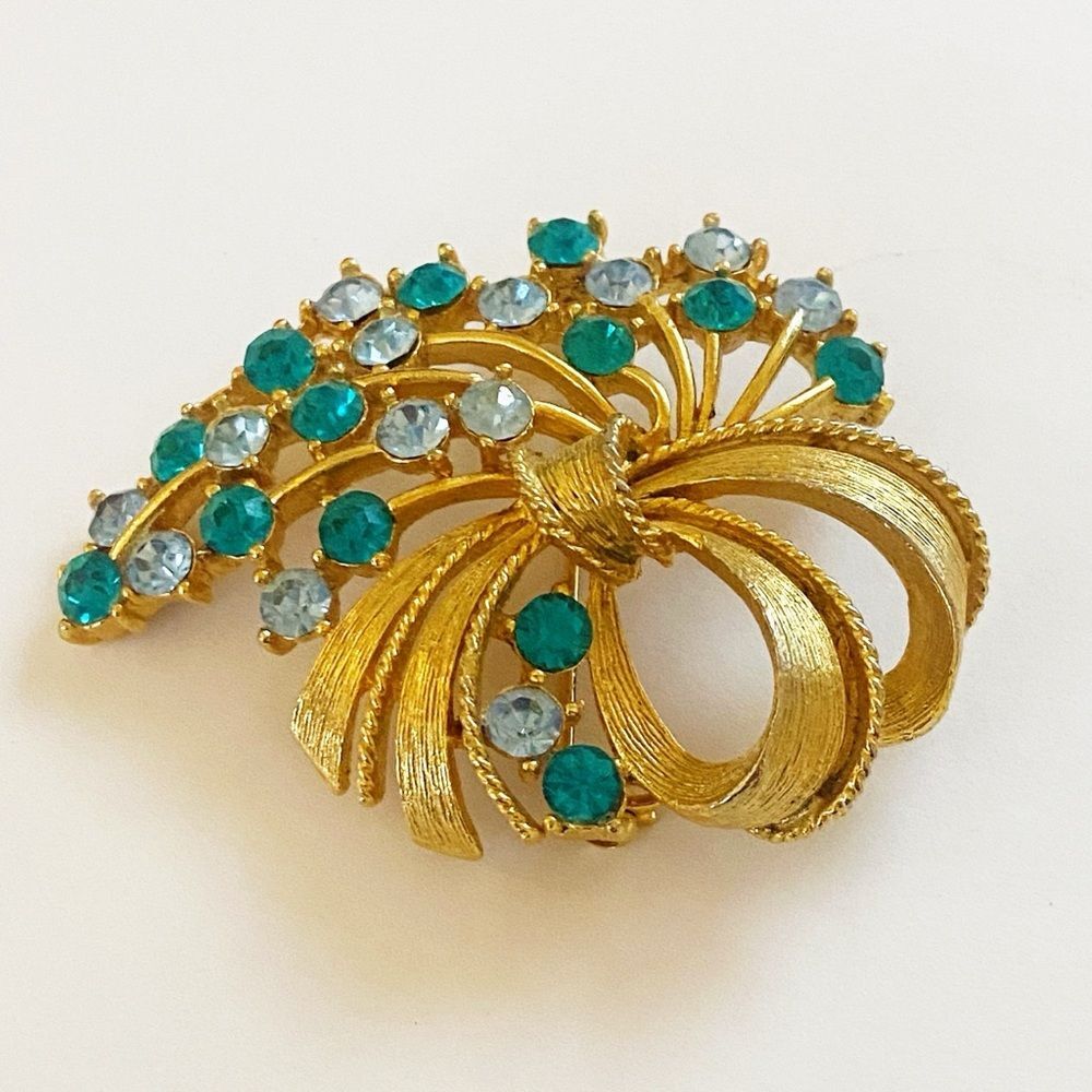 Vintage Lisner blue rhinestone gold tone bow brooch